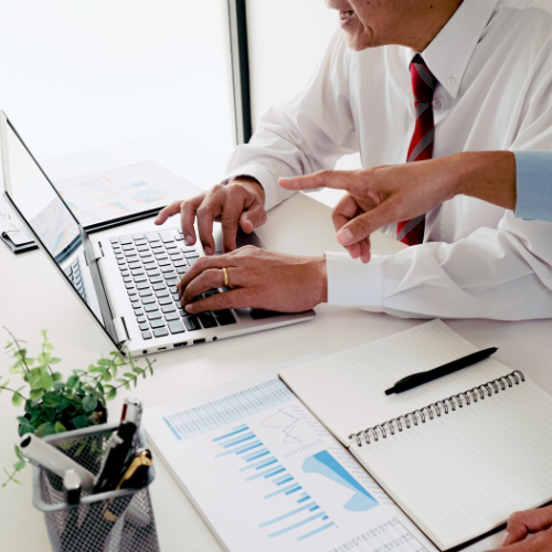 An image of someone looking at a computer, reading an intranet article.